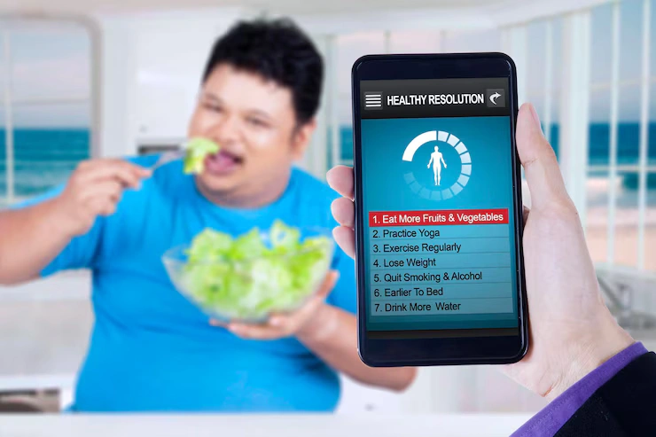 healthy resolutions app with man eats salad 175634 41467
