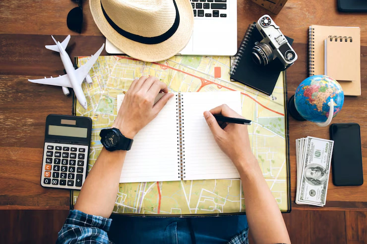 male hand holding pen notebook map planning trip copy space travel background 38391 684