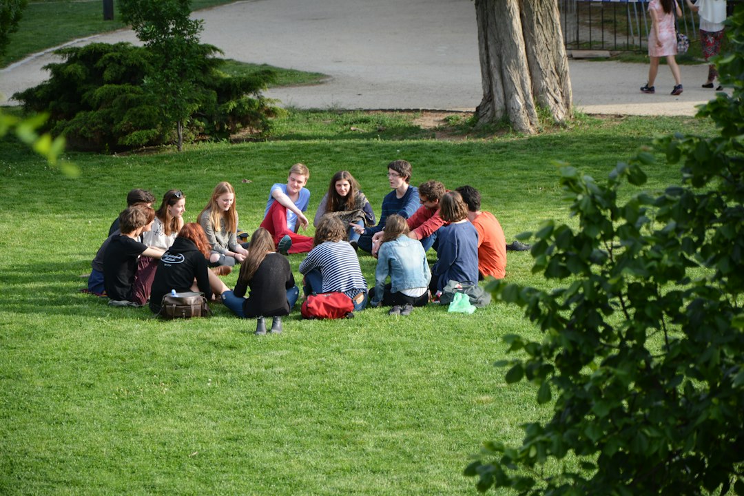 Friends sitting together outdoors, representing a personal support network