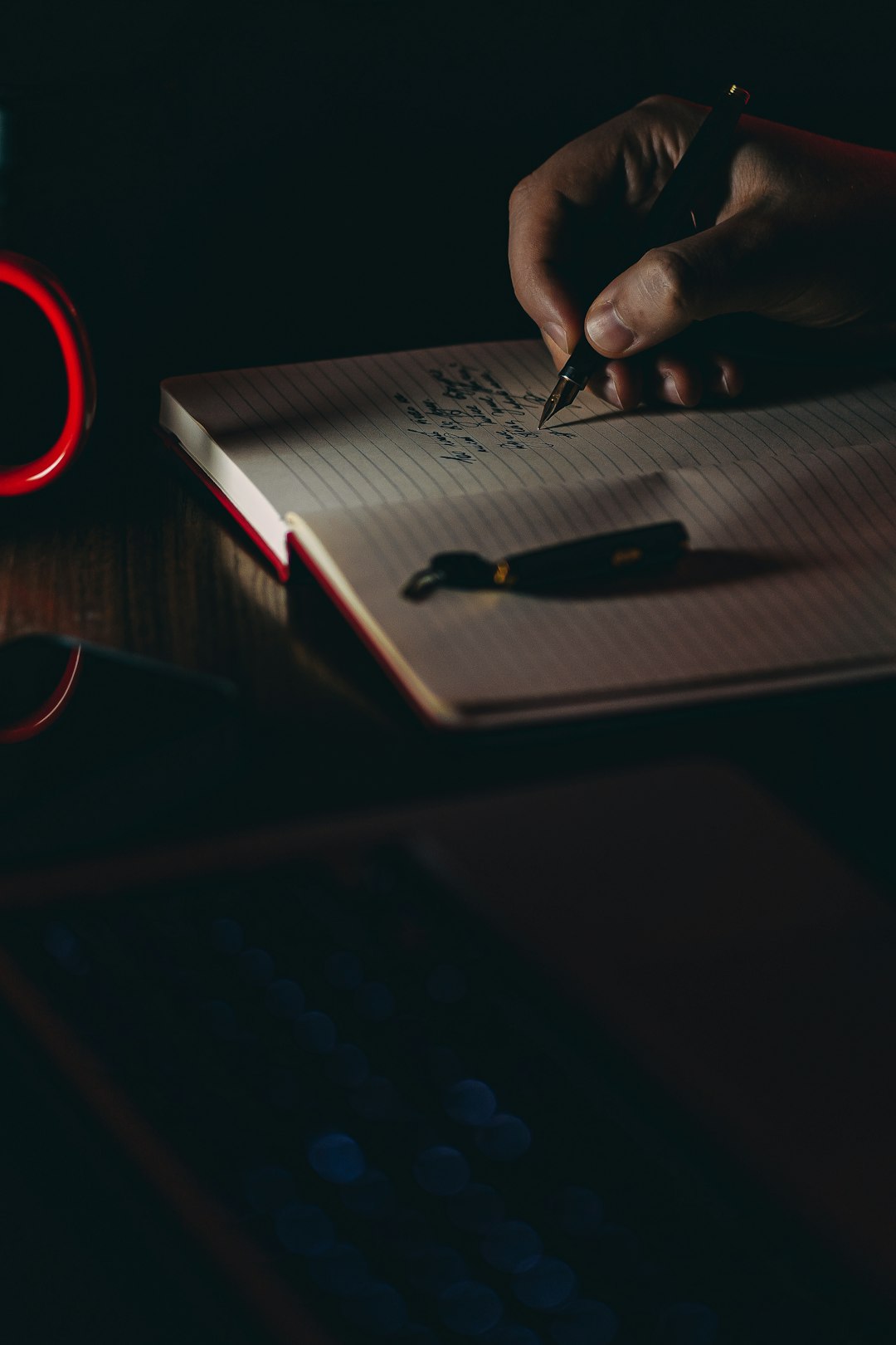 Person writing a personal growth plan in a notebook